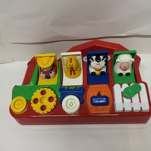 Fisher price pop up animals hotsell