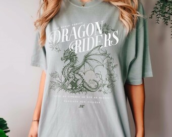 May include: A light green oversized t-shirt with a graphic print of a dragon with the text "The World Famous Dragon Riders" and "Live as Cowards or Die as Riders" with the text "Brigatith War College" below.