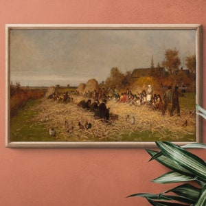 May include: A vintage oil painting depicting a group of people gathered in a field, likely during a harvest. The scene is set in a rural area with hay bales and a farmhouse in the background. The people are dressed in clothing typical of the 19th century, and some are holding tools or baskets. The painting is framed in a simple wooden frame.