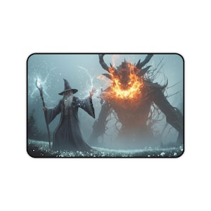 May include: Rectangular mousepad featuring a fantasy scene. A wizard with a staff faces a fiery demon in a misty field. The wizard wears a gray robe and hat, while the demon is a dark, tree-like figure with flames.