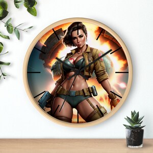 May include: A round clock with a wood frame features a colorful illustration of a woman in a military-style outfit holding a gun. The background is a fiery explosion with a spaceship in the distance.