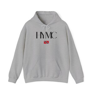 May include: A gray hooded sweatshirt with the text "HYMC" and the flag of Trinidad and Tobago printed on the front.