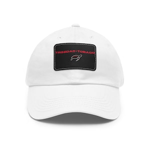 May include: White baseball cap with a black patch featuring the text "TRINIDAD+TOBAGO" in red lettering and a red outline of a sea turtle.