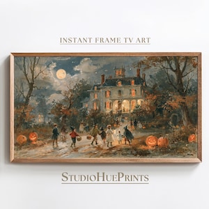 May include: A rectangular framed wall art print titled INSTANT FRAME TV ART by STUDIOHUEPRINTS. The artwork depicts a nighttime Halloween scene with children in costumes walking toward a large, illuminated house under a full moon and pumpkins.
