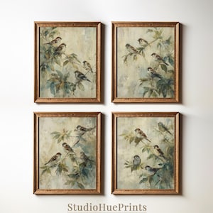 May include: Four framed art prints displaying watercolour paintings of sparrows on leafy branches. The artwork has a vintage aesthetic with soft colours and a textured background. The frames are made of wood. The text "StudioHuePrints" is at the bottom.