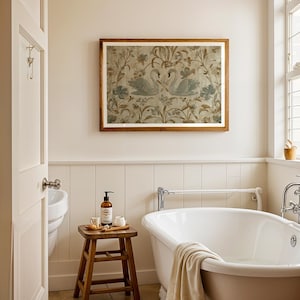 May include: A bathroom scene featuring a white clawfoot tub, a wooden stool with toiletries, and a framed artwork with swan imagery. The walls are painted in a neutral color, and the room has a classic, elegant aesthetic.