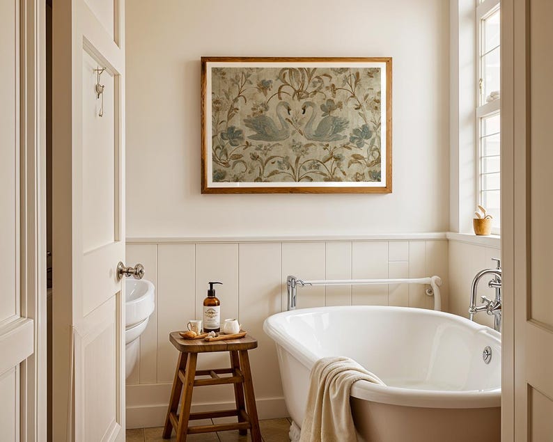 May include: A bathroom scene featuring a white clawfoot tub, a wooden stool with toiletries, and a framed artwork with swan imagery. The walls are painted in a neutral color, and the room has a classic, elegant aesthetic.