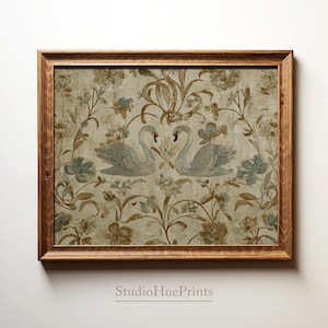 May include: Framed artwork featuring two swans facing each other, set against a backdrop of floral patterns in muted blue, brown, and beige tones. The artwork is enclosed in a wooden frame, adding a touch of rustic elegance. The text "StudioHuePrints" is at the bottom.