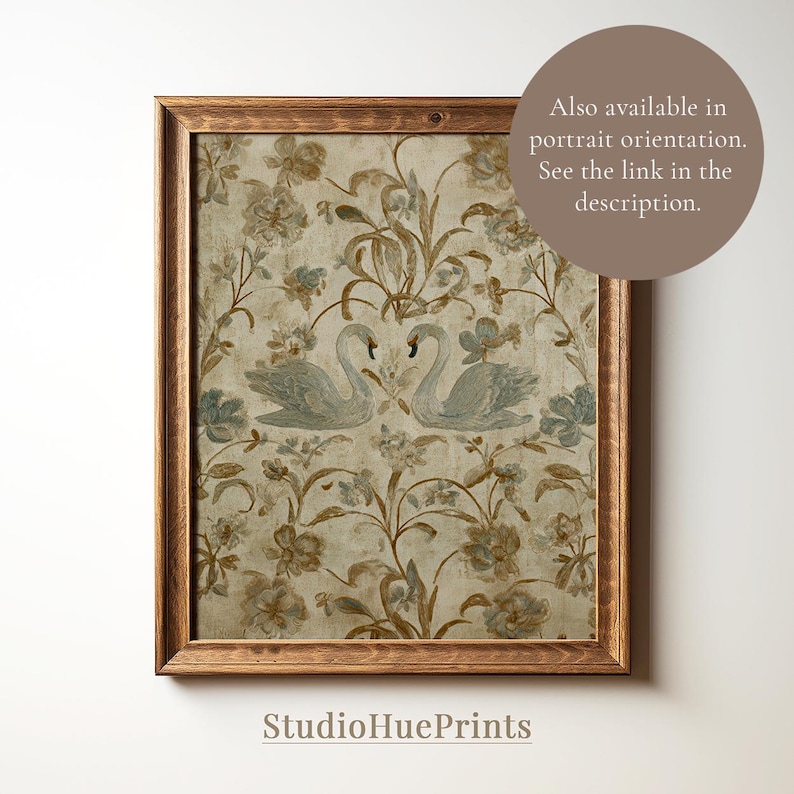 May include: A framed print featuring a vintage-style floral pattern with two swans. The artwork has a beige background with blue and brown floral accents. The frame is made of wood. The text "StudioHuePrints" is at the bottom.