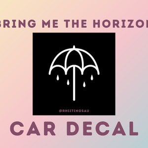 May include: Black and white car decal featuring the Bring Me The Horizon band logo, an umbrella with raindrops, and the text "@RHIIITINGSBAU".