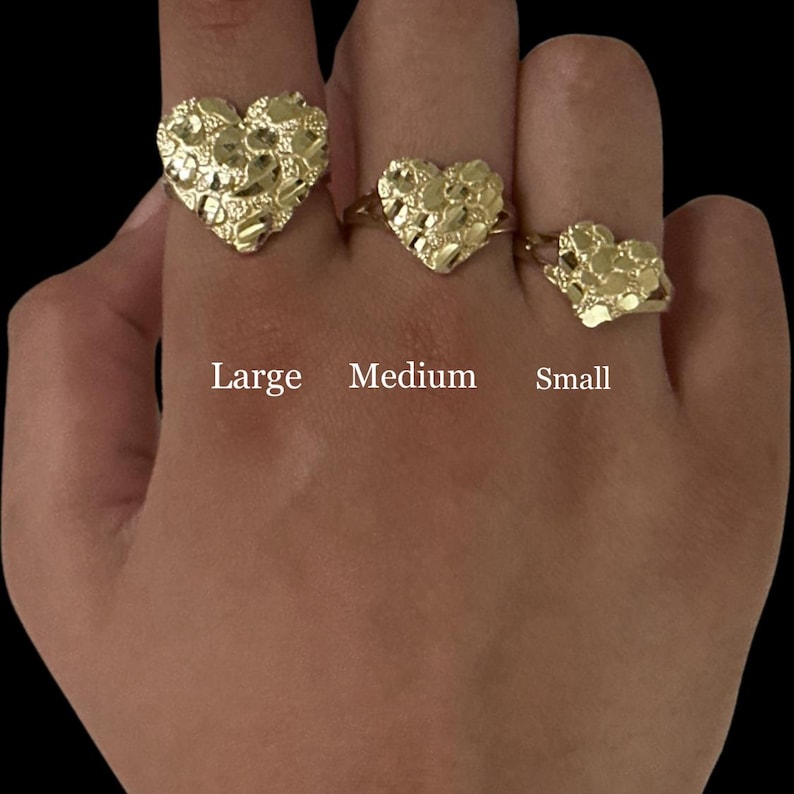 May include: Three gold heart-shaped rings in different sizes, labeled "Large", "Medium", and "Small".