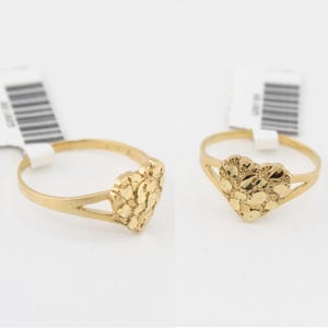 May include: A gold heart-shaped ring with a textured surface. The ring is made of 10k gold and is available in sizes 5-10.
