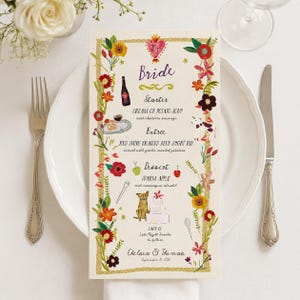 May include: A rectangular wedding menu card featuring a colorful floral border, a central heart illustration, and text detailing courses including cream of potato soup, red wine braised beef short rib, and warm apple strudel for Chelsea & Thomas.