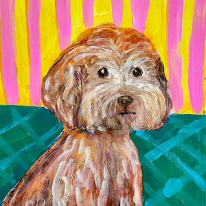 May include: An acrylic painting of a brown, fluffy dog with dark eyes and a small nose. The dog is positioned against a background of vertical yellow and pink stripes, while the lower portion features a teal surface with a cross-hatched pattern.
