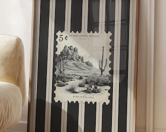 May include: Framed print featuring a vintage postage stamp design. The stamp depicts a desert landscape with mountains and cacti. The background has black and white vertical stripes. The text "5¢" and "FIVE CENTS ONLY" are visible.