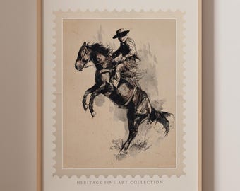 May include: Framed vintage print featuring a cowboy riding a rearing horse. The black and white illustration is set against a beige background with a stamp-like border. The text "HERITAGE FINE ART COLLECTION" is at the bottom.