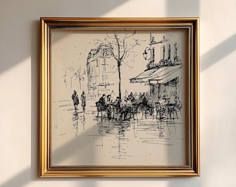 May include: A framed black and white sketch of a Parisian cafe scene. The artwork depicts a street with a cafe, people, and buildings. The frame is gold-colored and square.