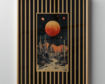 May include: Framed art print featuring a desert landscape under a large, orange moon. The artwork is set within a black and gold striped frame. The desert scene includes cacti and a starry night sky.