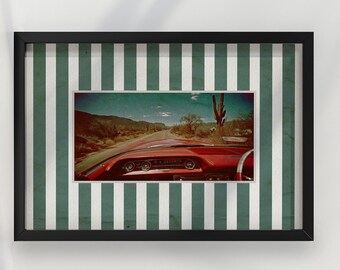 May include: Framed print featuring a vintage red car driving on a desert road. The image is set against a green and white striped background within a black frame. The car's dashboard and steering wheel are visible.