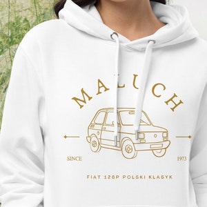 May include: White hoodie with a drawstring hood and a kangaroo pocket. The front features a gold-colored graphic of a car with the text "MALUCH" above and "FIAT 126P POLSKI KLASYK" below, with "SINCE 1973" on either side.