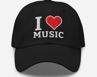 May include: Black baseball cap with the embroidered phrase "I ♥ MUSIC". The heart is red, and the text is white. The cap has a curved brim and an adjustable strap.