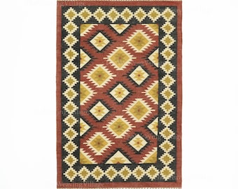 May include: Rectangular rug with a geometric pattern in shades of red, black, yellow, and cream. The rug features a diamond pattern with a fringed border. The design is symmetrical and the rug is likely made of woven material.