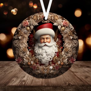 May include: Round Christmas ornament featuring a detailed illustration of Santa Claus with a white beard and red hat, surrounded by a wreath of gold and red flowers and leaves.