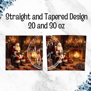May include: A tumbler with a festive Christmas design. The image features Santa Claus in a red suit, seated in a chair by a fireplace, reading. The tumbler is available in straight and tapered designs, in 20 and 30 oz sizes.