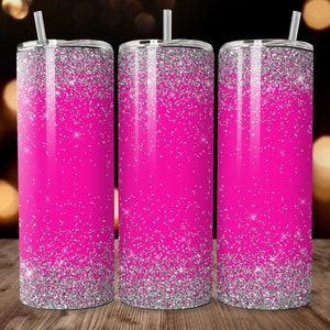May include: Three stainless steel tumblers with a pink and silver glitter design. The tumblers have a silver glitter base and a pink glitter top.