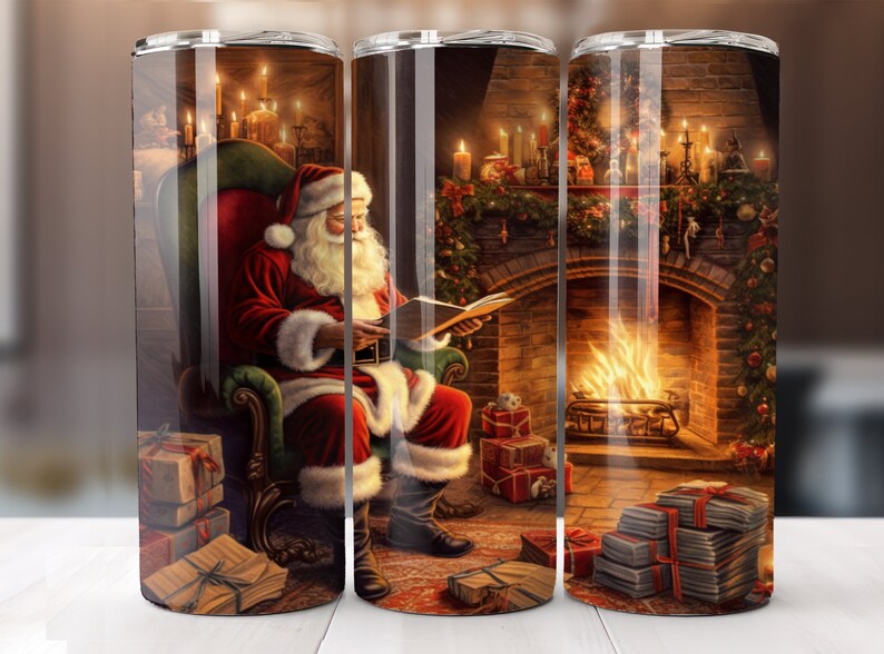 May include: A stainless steel tumbler featuring a festive Christmas scene. Santa Claus, in his red suit and hat, is seated in a chair reading a book. A fireplace with a roaring fire and wrapped gifts are also depicted. The tumbler is designed for hot or cold beverages.