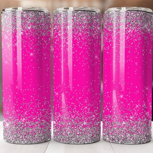May include: Three stainless steel tumblers with a pink and silver glitter design. The tumblers are lined up in a row on a white surface.