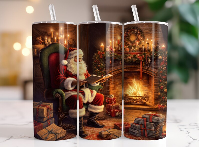 May include: A set of three stainless steel tumblers featuring a festive Christmas scene. Each tumbler depicts Santa Claus reading a book in a cozy room with a fireplace, gifts, and candles. The design is detailed and colorful, perfect for holiday beverages.