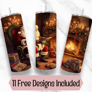 May include: Three stainless steel insulated tumblers with Christmas-themed designs. One features Santa Claus in a chair, another shows Santa reading, and the third depicts a fireplace. The text "11 Free Designs Included" is at the bottom.