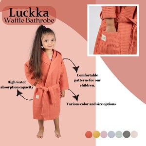 A 100% COTTON waffle bathrobe suitable for children aged 2-4 years old