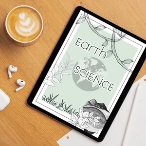 May include: A tablet displaying a digital cover titled Earth Science in black lettering. The design features a pale green background with black line art illustrations of vines, grass, a globe, and a mountain landscape at the bottom of the screen.