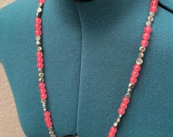 Red Beaded Necklace Featuring Intricate Spacers