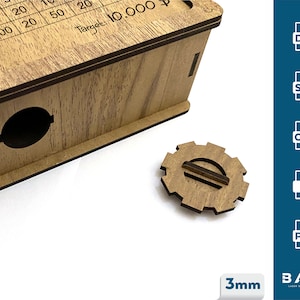 May include: Wooden box with a grid pattern on the top and a small gear-shaped piece. The box has a target of 10,000 printed on it. The gear is made of wood and has a slot in the center. The box is 3mm thick.