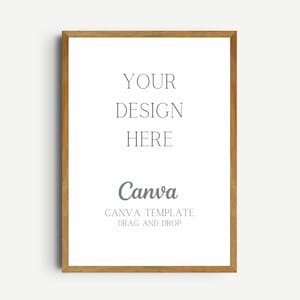 Könnte beinhalten: Ein Holzrahmen mit weißem Hintergrund. Der Text "YOUR DESIGN HERE" ist in Schwarz gedruckt. Der Text "Canva" ist in Grau gedruckt mit dem Text "CANVA TEMPLATE DRAG AND DROP" darunter.