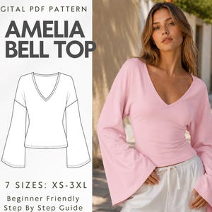 Peut inclure: Un patron PDF numérique pour le haut Amelia Bell, présentant un dessin au trait d'un haut à manches longues avec un col en V et des manches évasées. Le texte indique Digital PDF Pattern, Amelia Bell Top, 7 Sizes: XS-3XL, Beginner Friendly Step By Step Guide.