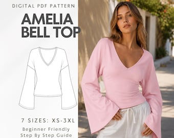 May include: A digital PDF pattern for the Amelia Bell Top, featuring a line drawing of a long-sleeved top with a V-neckline and flared sleeves. The text reads Digital PDF Pattern, Amelia Bell Top, 7 Sizes: XS-3XL, and Beginner Friendly Step By Step Guide.