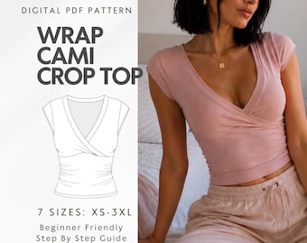 May include: A digital PDF sewing pattern for a wrap cami crop top. The image displays the text WRAP CAMI CROP TOP, 7 SIZES: XS-3XL, and Beginner Friendly Step By Step Guide. A line drawing of the top is shown alongside a photo of the top worn.