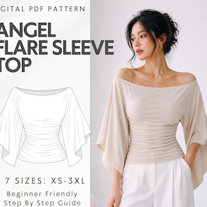 Peut inclure: Un patron PDF numérique pour un haut à manches évasées style ange, présentant un dessin au trait du vêtement avec une large encolure bateau et un corsage froncé. Le texte indique : DIGITAL PDF PATTERN, ANGEL FLARE SLEEVE TOP, 7 SIZES: XS-3XL.