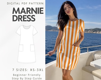 May include: A digital PDF pattern for the Marnie Dress, featuring a line drawing of a short-sleeved dress with two front pockets. The pattern includes 7 sizes from XS to 3XL and a step-by-step guide for a dress with vertical orange and white stripes.