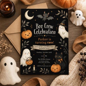 May include: A black rectangular birthday invitation card featuring illustrations of a crescent moon, a bat, two ghosts, two pumpkins, a black cat, and a candle. The text reads: Boo Crew Celebration, Parker is turning two!, Join us for a spooktacular birthday party, Sunday, October 20th, 2:00 PM, The Willow House, 22 Green Avenue, Pine Lake, Any State, RSVP to Emily: 555-0175.