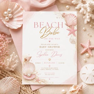 May include: A rectangular baby shower invitation card with a white background, featuring pink and gold text that reads BEACH Babe ON THE WAY, honoring Sophia Davis on Sunday, July 20, 2026, at 12:30 PM at 53 Ocean Pearl Drive, Santa Monica, CA 90401.
