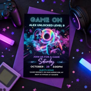 May include: A gaming-themed invitation with the text "GAME ON" and "ALEX UNLOCKED LEVEL 9". The design features a neon number 9, a game controller, and headphones. The invitation includes the date, time, and location for a party.