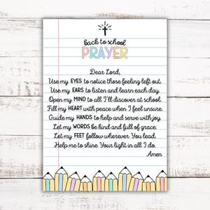 May include: A printed prayer for back to school on lined paper. The title "back to school PRAYER" is in colorful letters. The prayer includes phrases like "Use my eyes" and "Let my words." A row of colorful pencils decorates the bottom.