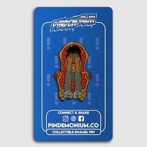 May include: Collectible enamel pin featuring a cartoon figure seated on a red and gold throne, covering their face. The pin has the text "PINDEMONIUM" and "PINDEMONIUM.CO COLLECTIBLE ENAMEL PIN" on a blue background.
