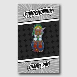 May include: Enamel pin featuring a cartoon character with green and brown clothing, seated on a blue bomb. The pin is on a black and white background with the text "Pindemonium" and "Enamel Pin".