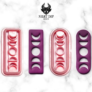 Può includere: Tre stampi in silicone per la colata di resina, con un design a fasi lunari. Gli stampi sono rosa, viola e viola. Gli stampi sono rettangolari, ovali e rettangolari.